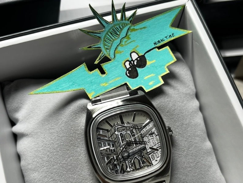 Qui est Racno, ce petit personnage qui accompagne les montres peintes à la main NoracTime